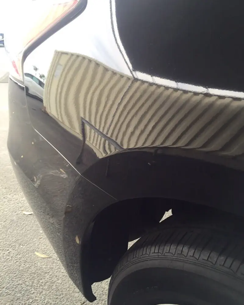 After: Black quarter panel, read in the reflection