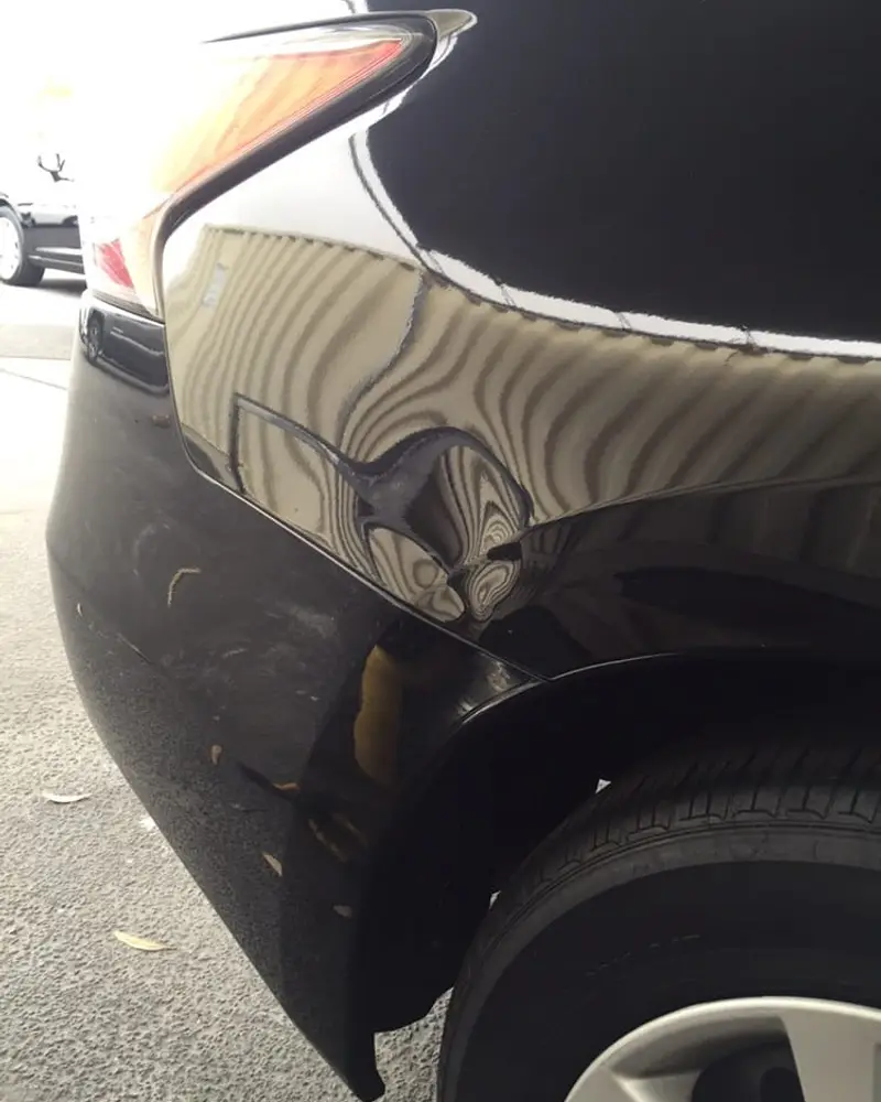 Before: Black quarter panel, read in the reflection