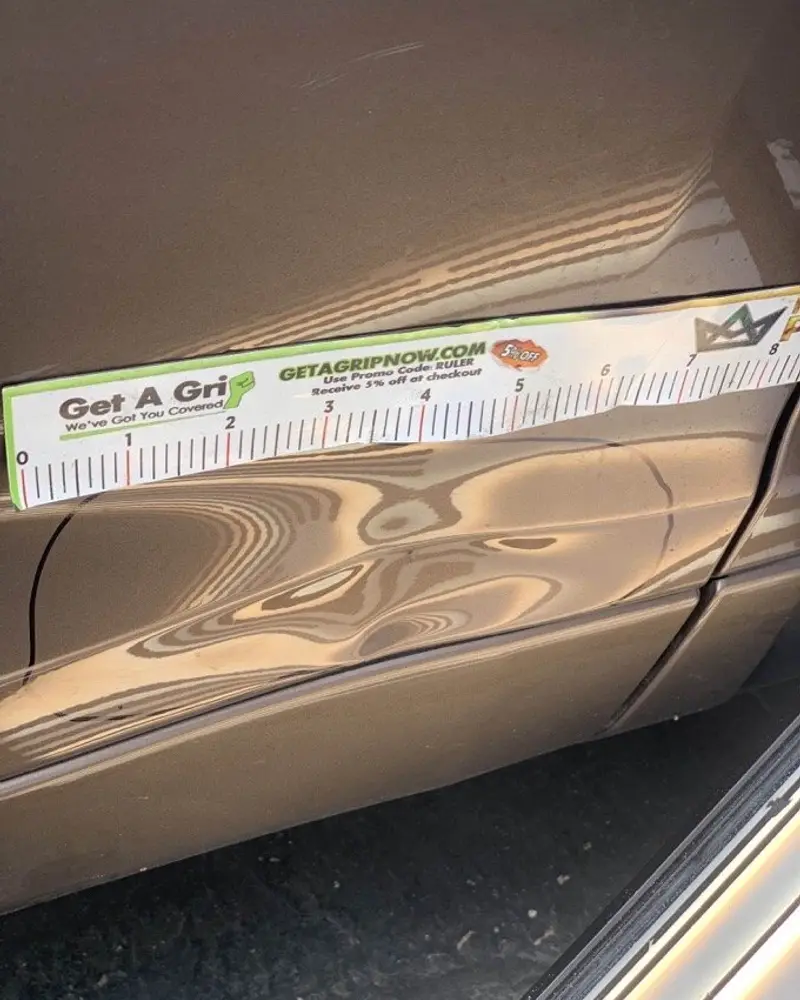 Line board and ruler showing the shape of a dent